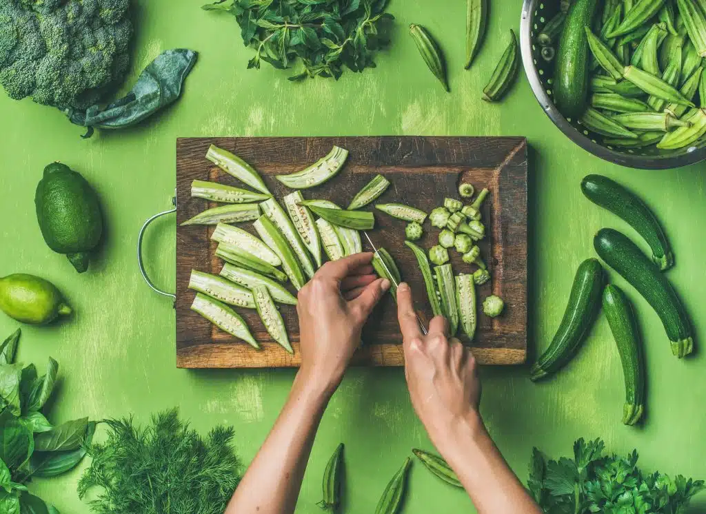 Flat-lay of healthy green vegan cooking ingredients